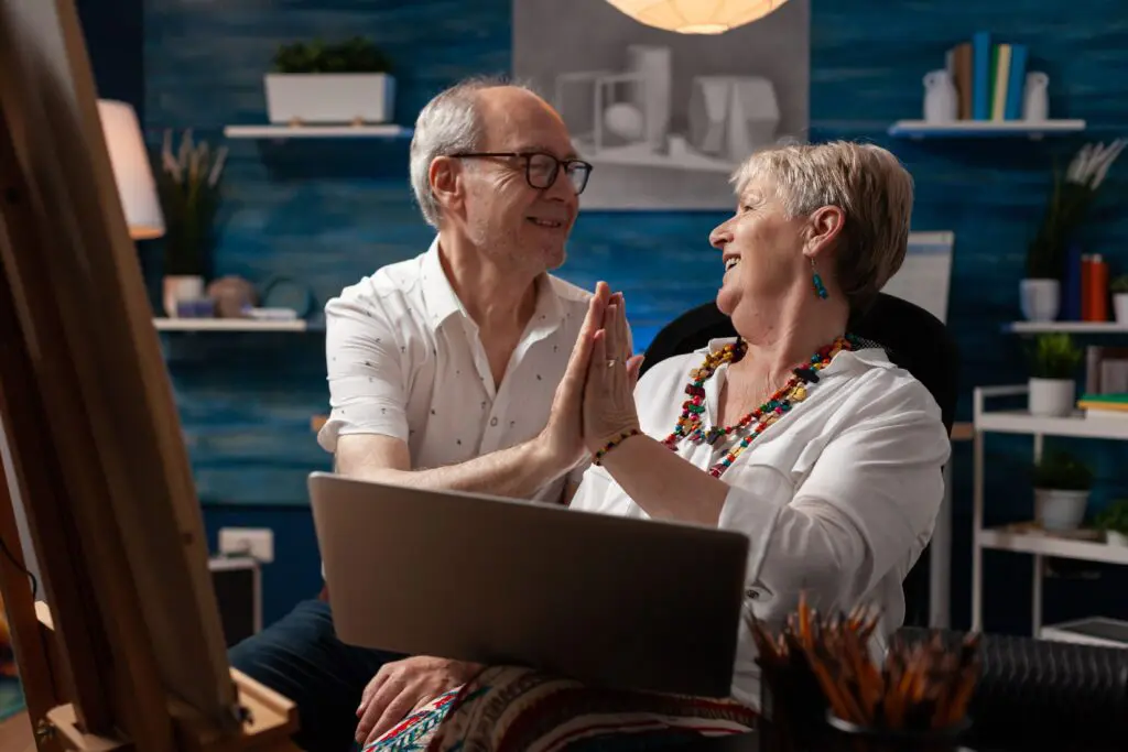 Two smiling British retirees looking at each other while enjoying their life in France